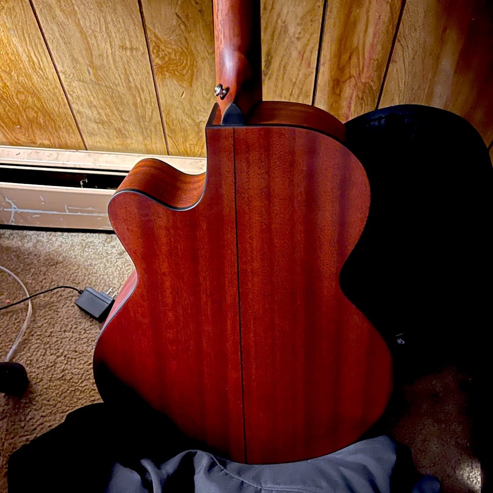 A new Jasmine acoustic guitar with black carry case